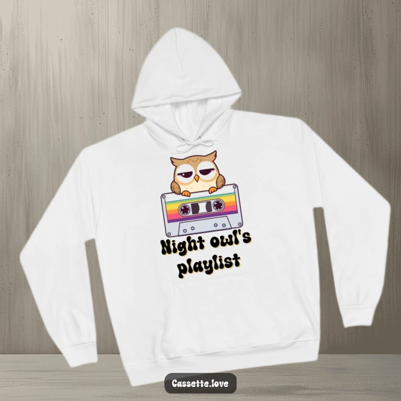 Funny Hoodie showcasing a winking owl perched on a colorful cassette tape, offering retro music charm and cozy warmth.