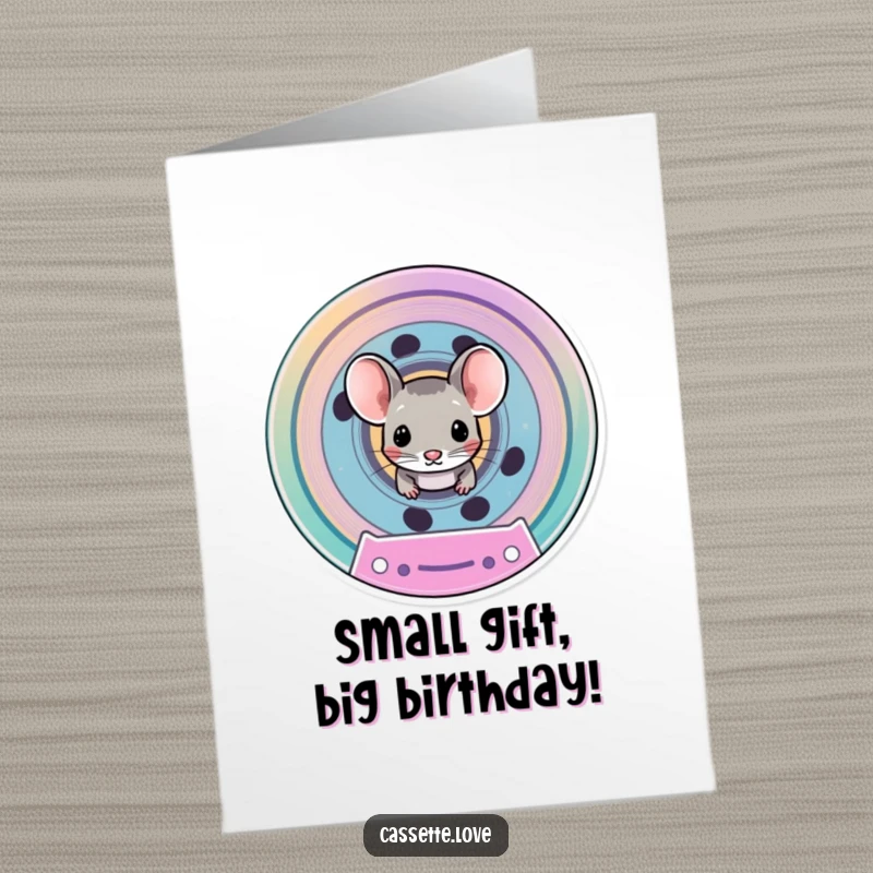 Funny free printable birthday card with a tiny mouse peeking from a colorful cassette spool, offering birthday wishes.