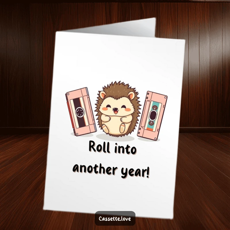 Funny free printable birthday card of a happy hedgehog rolling between vintage cassette tapes, bringing retro birthday cheer.